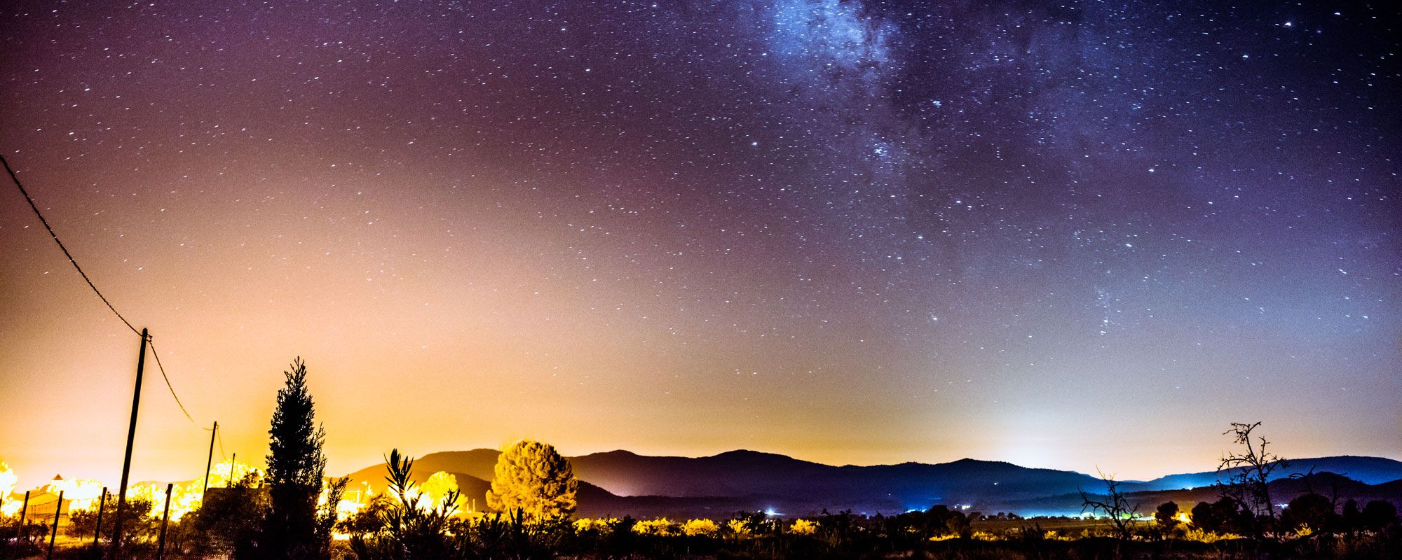 Starry night with mountains in the distance